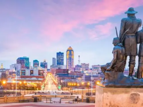 Statues overlook the Des Moines skyline