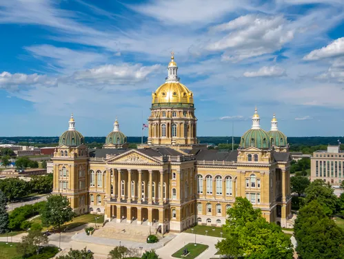 Exterior of the Iowa capitol with blue skie