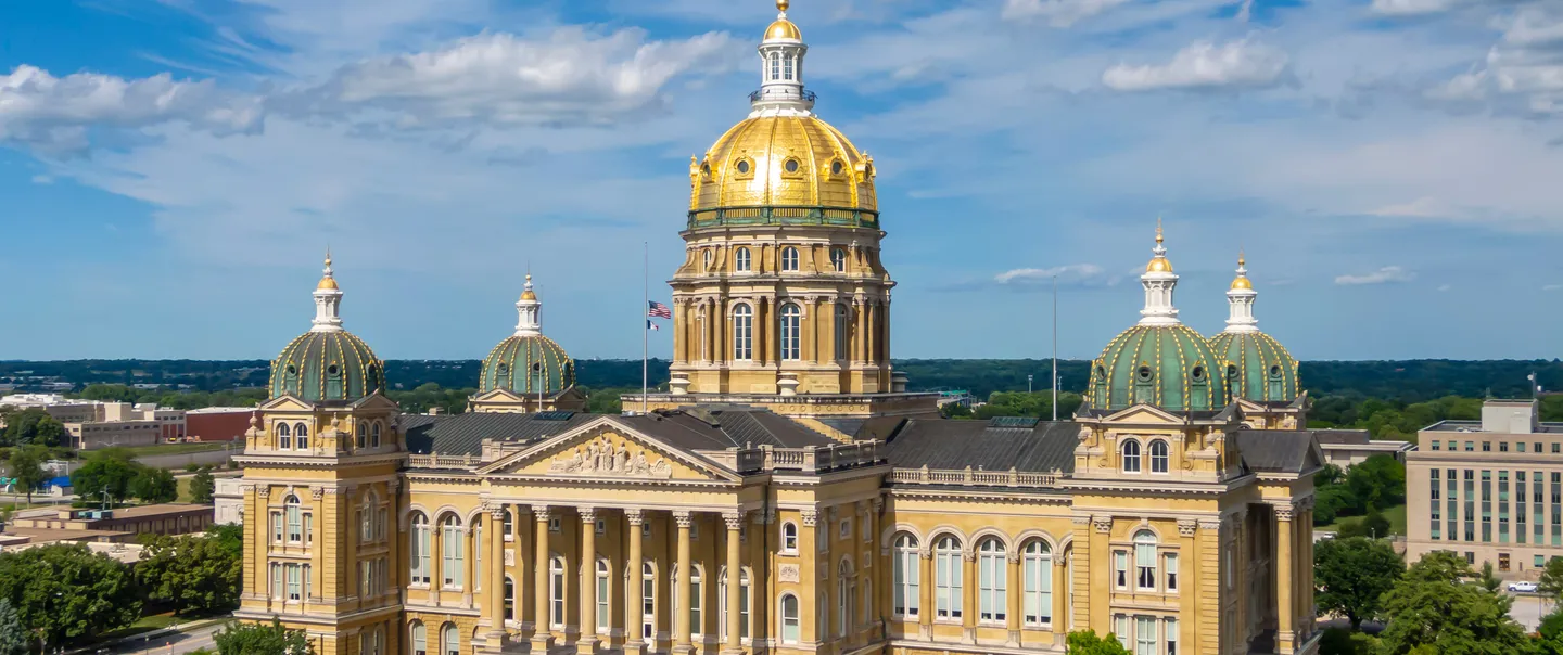 Exterior of the Iowa capitol with blue skie