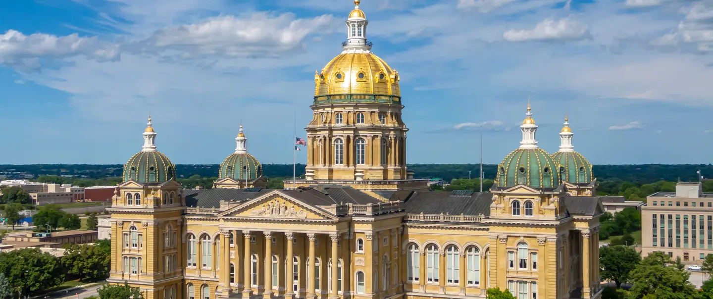 Exterior of the Iowa capitol with blue skie